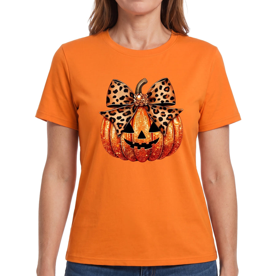 Woman wearing the orange pumpkin graphic henley top