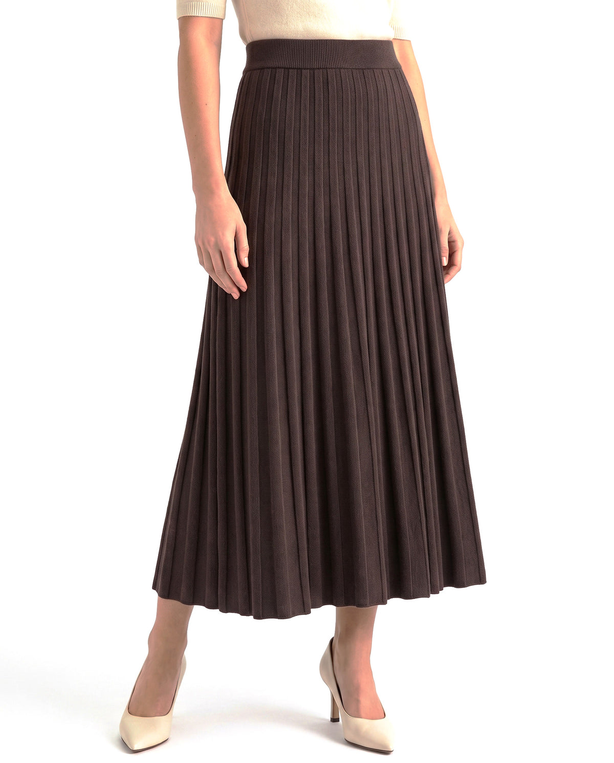 Women's elastic-waist flared midi skirt in coffee brown, worn with cream heels