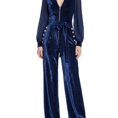 Sabine women's sheer-sleeve velvet wide-leg jumpsuit in dark blue, worn by a model on a white background