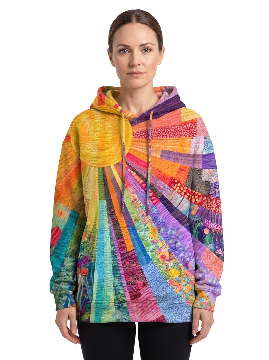 Ophelia-Sigrid Women's Oversized Drawstring-Hood Pullover Hoodie in multicolour sun patchwork print, worn by a model
