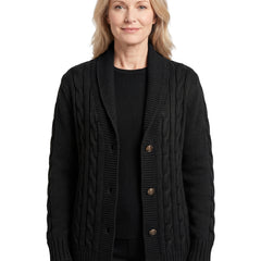 Women's chunky cable-knit black button cardigan worn by a model