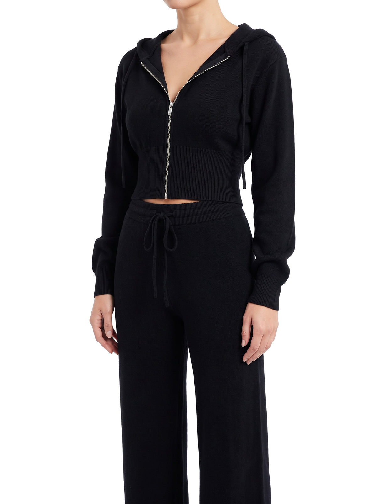 Women's black zip-up cropped hoodie and wide-leg knit set