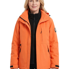 Woman wearing the orange water-repellent hooded parka with removable fleece liner