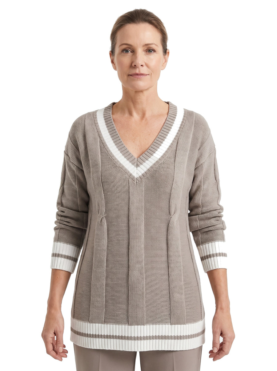 Woman wearing the Alba-Carmen soft knit V-neck sweater in taupe and white